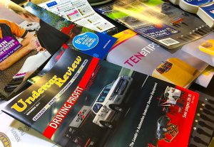 A pile of magazines and point of sale products