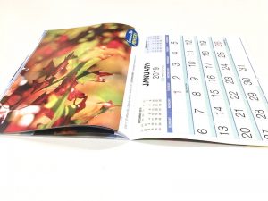 Calendars saddle stitched through the centre
